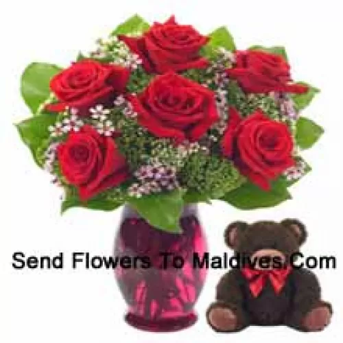 6 Red Roses With Some Ferns In A Glass Vase Along With A Cute 14 Inches Tall Teddy Bear