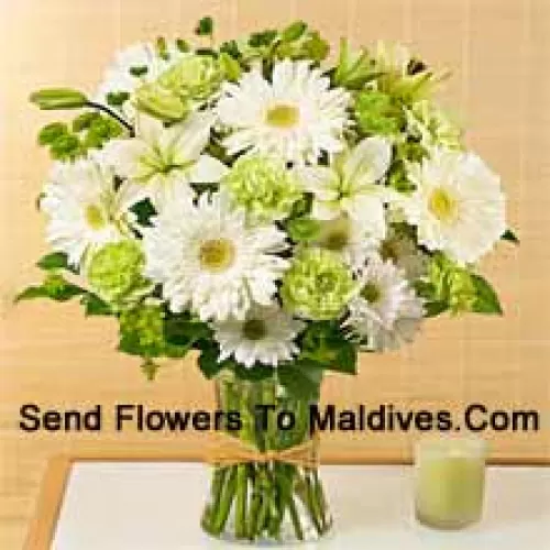 White Gerberas, White Alstroemeria And Other Assorted Seasonal Flowers Arranged Beautifully In A Glass Vase