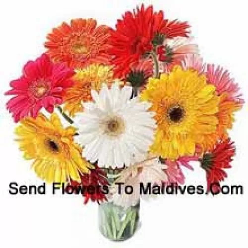 18 Mixed Colored Gerberas With Some Ferns In A Glass Vase