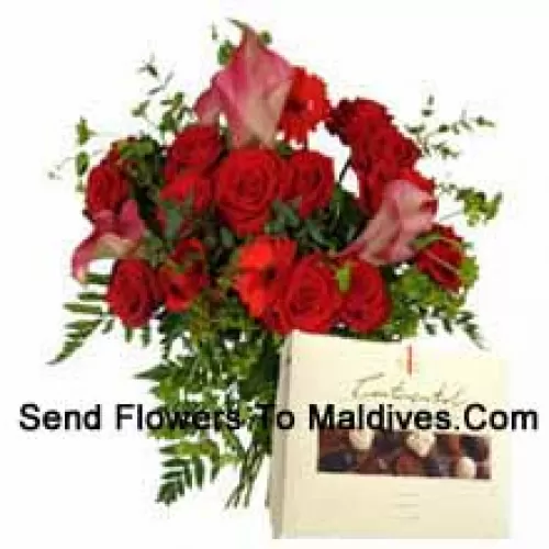 Red Gerberas And Red Roses In A Vase Along With A Box Of Chocolate