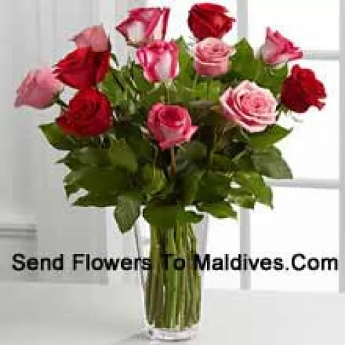 4 Red, 4 Pink And 4 Dual Toned Roses With Seasonal Fillers In A Glass Vase