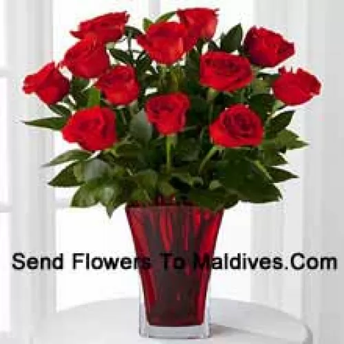 12 Red Roses With Some Ferns In A Vase