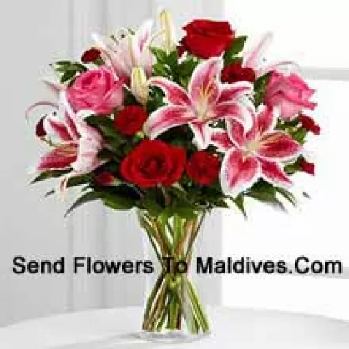 Red And Pink Roses With Pink Lilies And Seasonal Fillers In A Glass Vase