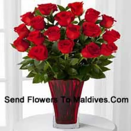 18 Red Roses With Seasonal Fillers In A Glass Vase Decorated With A Pink Bow