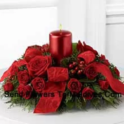 A crimson display of holiday warmth and cheer. Rich red roses and spray roses, red hypericum berries and lush holiday greens encircle a red metallic pillar candle to create a heart-warming centerpiece. Bedecked with bright red ribbon, this design will bring the spirit of the holiday season to their gatherings and celebrations with style and grace.? (Please Note That We Reserve The Right To Substitute Any Product With A Suitable Product Of Equal Value In Case Of Non-Availability Of A Certain Product)